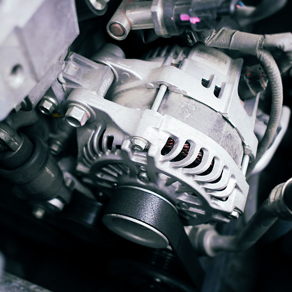 Open car engine compartment showing alternator in the New Port Richey and Port Richey, FL area
